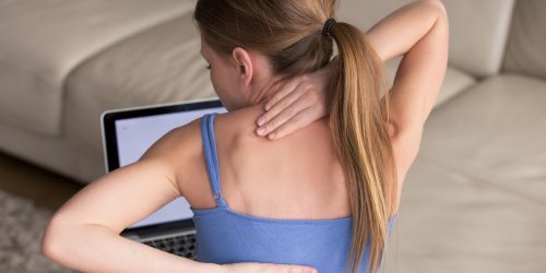 woman-massaging-her-tense-stiff-back-muscles (2)
